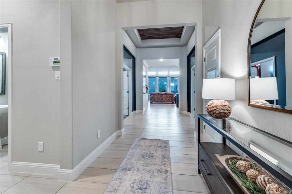 425 Acadia Lane Forney, TX 75126 - Photo 6 of 37 a hallway with a view of living room