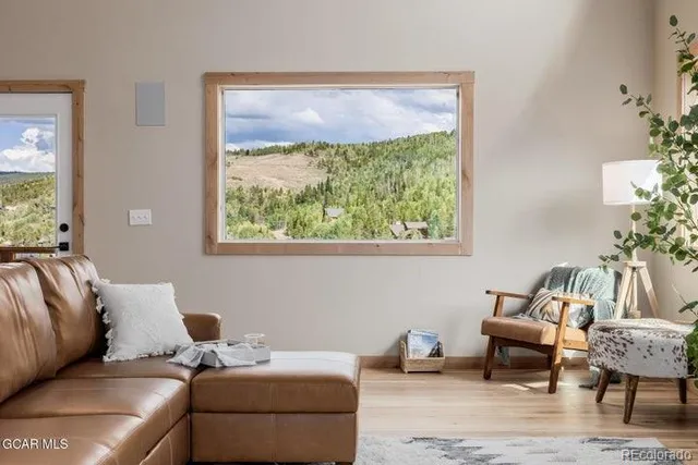 a living room with furniture and a window