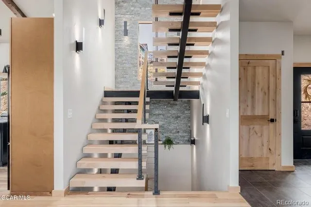 a view of entryway with wooden floor