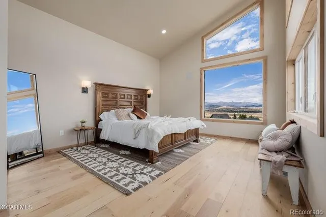 a bedroom with a bed and a lamp