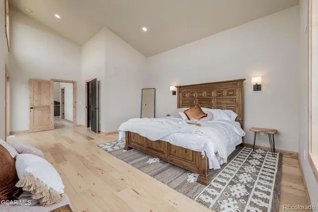 a bed room with two beds and a large window