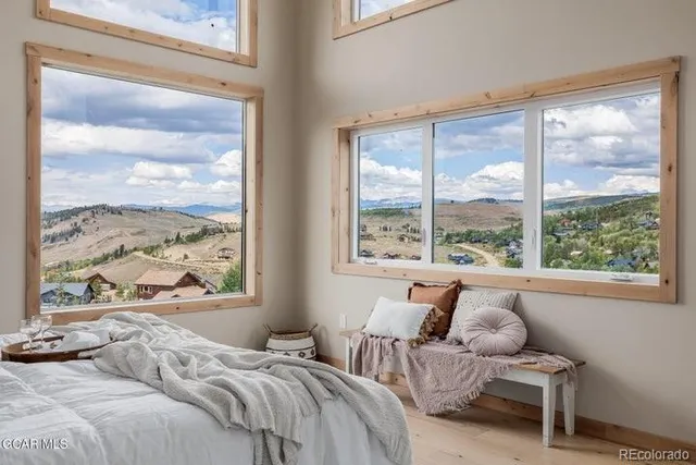 a bathroom with a bathtub a double vanity sink and mirror