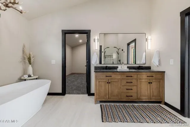 a bath room with a sink and a mirror