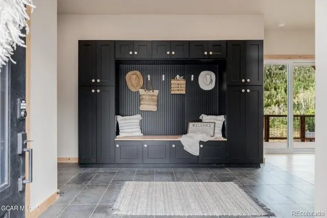 a view of living room with furniture and wooden floor