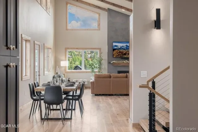 a dining room with furniture and window