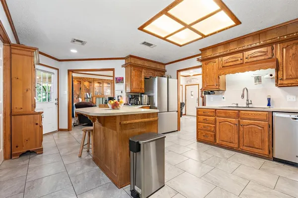 a kitchen with stainless steel appliances granite countertop a sink and a cabinets