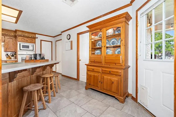 a bedroom with a bed and dresser