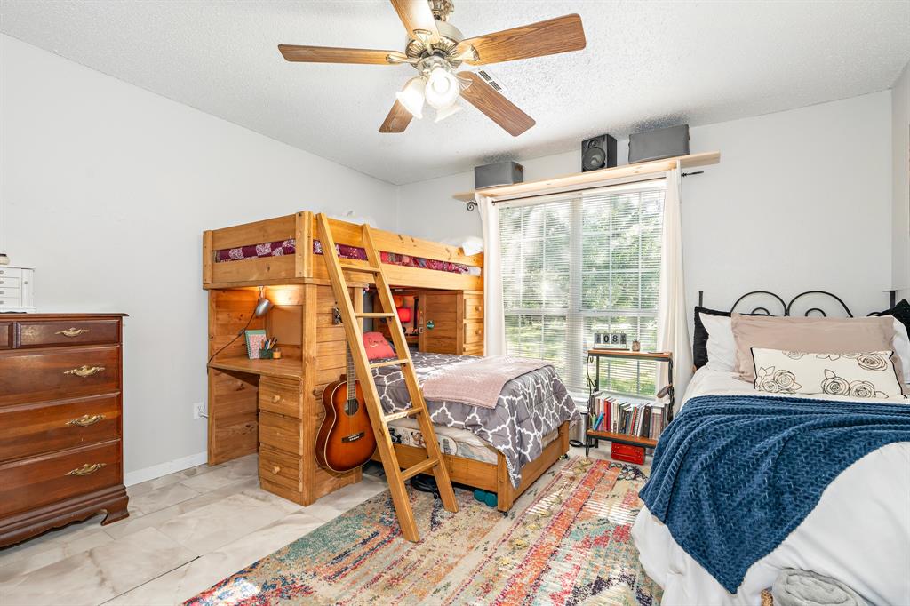 4037 Old Dallas Road Elm Mott, TX 76640 - Photo 22 of 40 a bedroom with a bed and a window