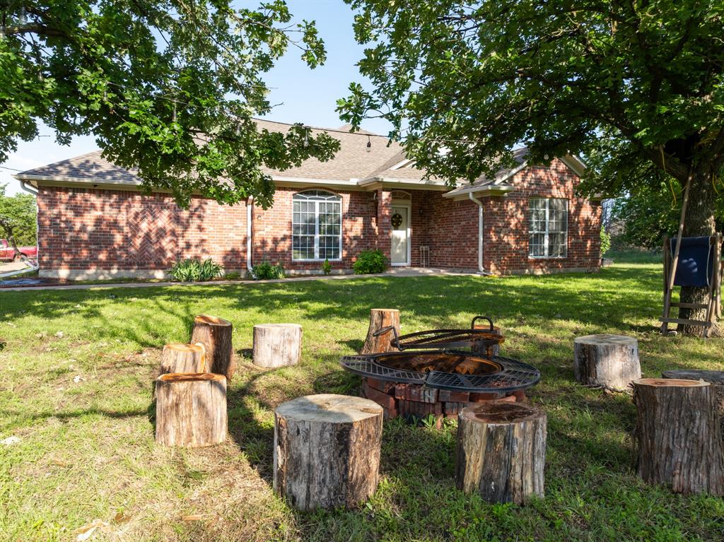 4037 Old Dallas Road Elm Mott, TX 76640 - Photo 27 of 40 a view of a house with backyard sitting area and swimming pool