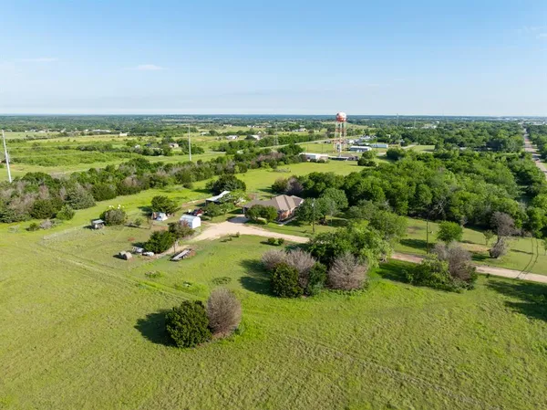 a view of a garden with an ocean