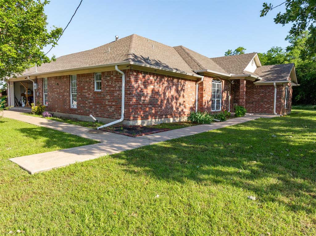 4037 Old Dallas Road Elm Mott, TX 76640 - Photo 5 of 40 a view of a house with a yard and pathway