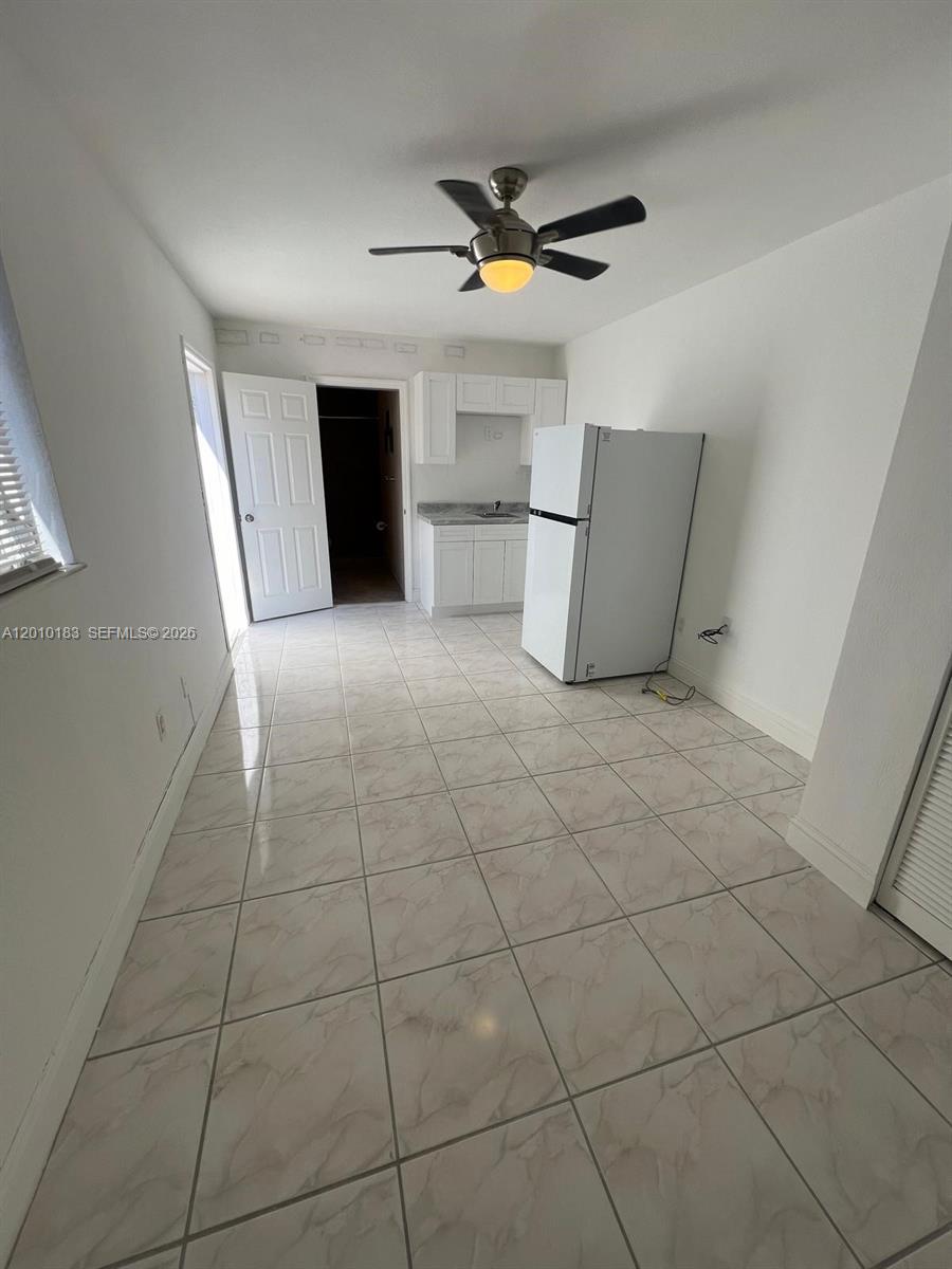 12255 Southwest 29th Terrace Miami, FL 33175 - Photo 4 of 5 a view of a livingroom with a furniture and a ceiling fan