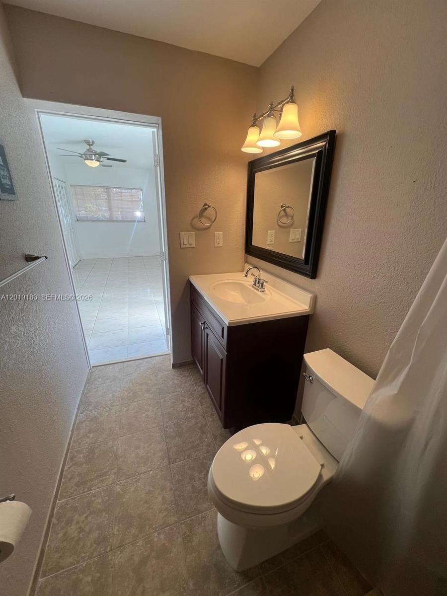 12255 Southwest 29th Terrace Miami, FL 33175 - Photo 5 of 5 a bathroom with a toilet a sink and mirror
