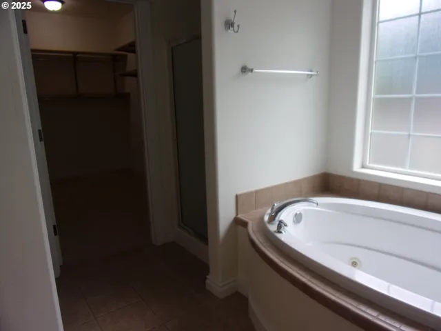 a view of a hallway with washer and dryer