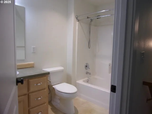 a view of a chair and table in the backyard