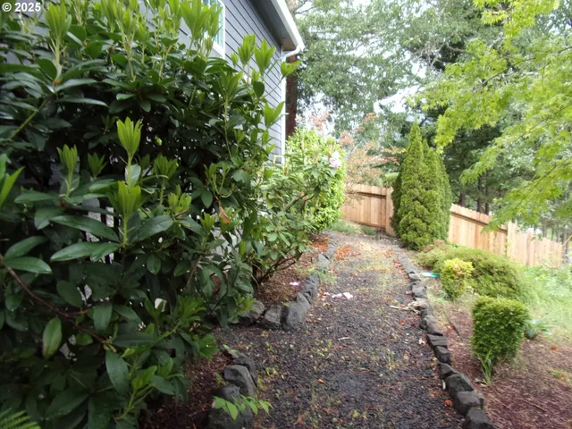 a bathroom with a granite countertop sink mirror toilet and bathtub