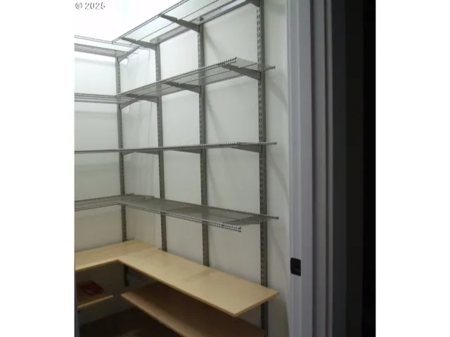 a kitchen with a cabinets and chandelier