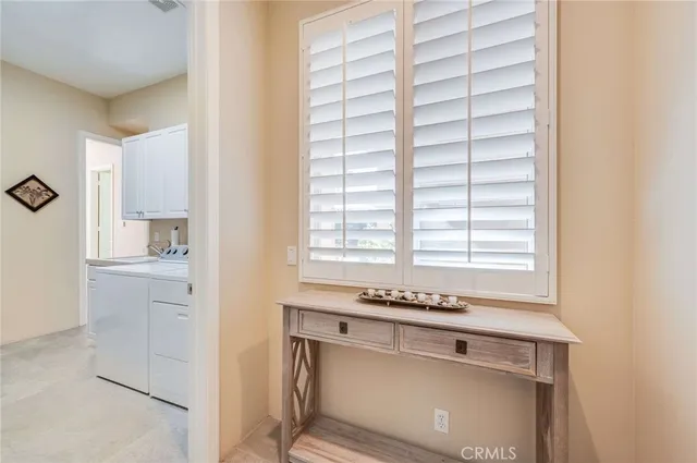 a view of kitchen with a sink and cabinets