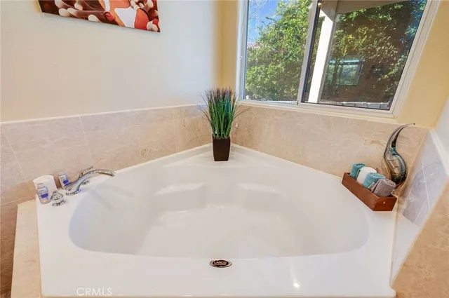 a white bath tub sitting in a bathroom