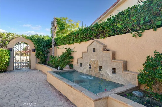 a view of a white house with a yard