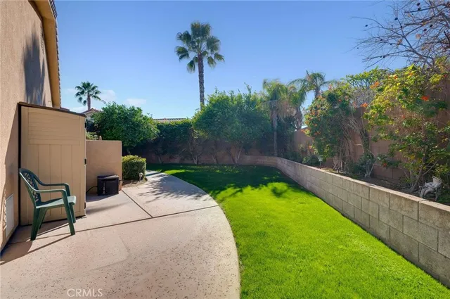 a view of a patio with a backyard