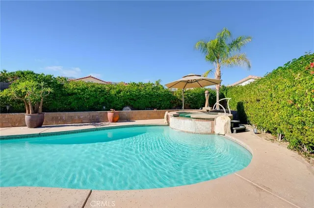 a view of a terrace with a garden and yard