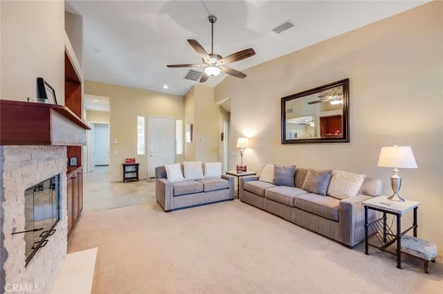 a living room with furniture and a fireplace