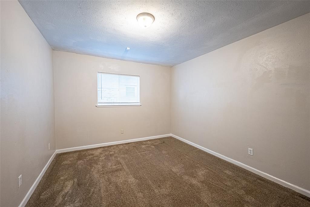 3401 Tarkio Road Plano, TX 75074 - Photo 7 of 11 an empty room with a window