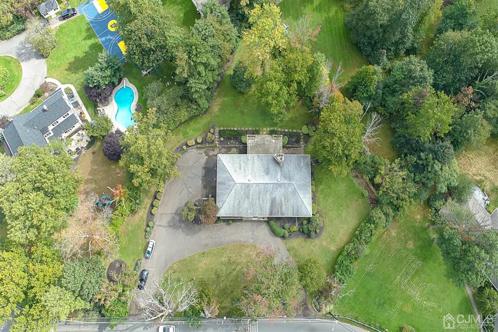 375 New Dover Road Colonia, NJ 07067 - Photo 3 of 56 an aerial view of a house with a yard basket ball court