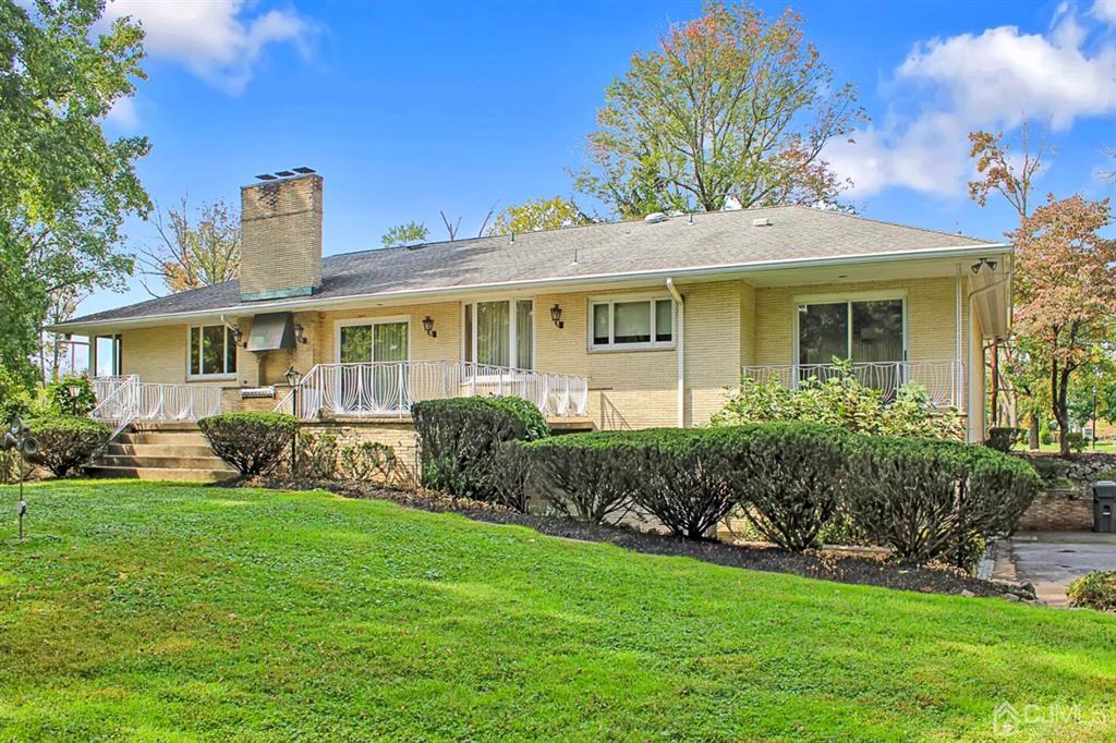 375 New Dover Road Colonia, NJ 07067 - Photo 54 of 56 a front view of a house with a yard