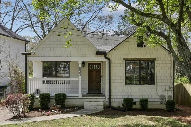 a front view of a house with garage