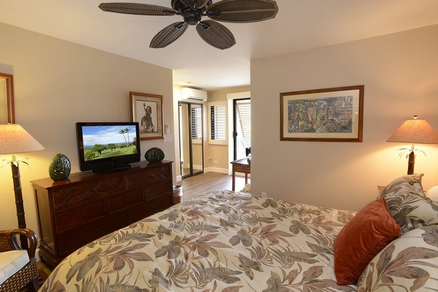 2777 South Kihei Road, Unit A207 Kihei, HI 96753 - Photo 24 of 30 a bedroom with a bed and a flat screen tv