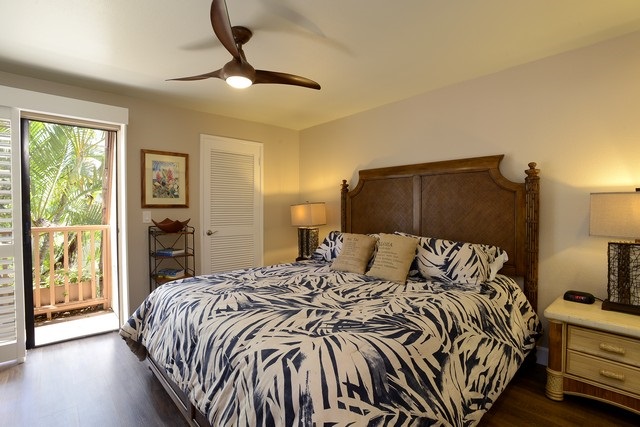 2777 South Kihei Road, Unit A207 Kihei, HI 96753 - Photo 25 of 30 a bedroom with a bed and a lamp next to a window