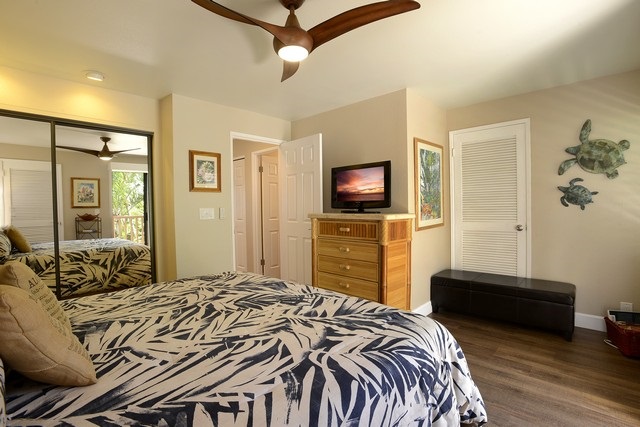 2777 South Kihei Road, Unit A207 Kihei, HI 96753 - Photo 26 of 30 a bedroom with a bed and a flat tv screen on dresser