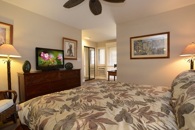 2777 South Kihei Road, Unit A207 Kihei, HI 96753 - Photo 27 of 30 a bedroom with a bed and a flat screen tv