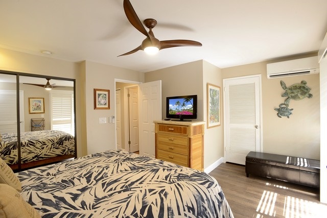2777 South Kihei Road, Unit A207 Kihei, HI 96753 - Photo 29 of 30 a bedroom with a bed and a flat screen tv