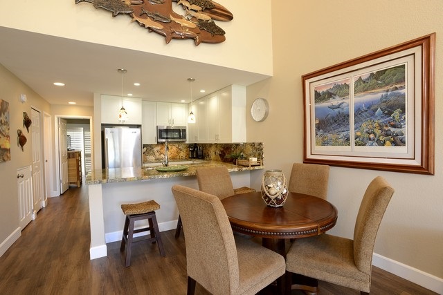 2777 South Kihei Road, Unit A207 Kihei, HI 96753 - Photo 9 of 30 a view of a dining room with furniture and wooden floor