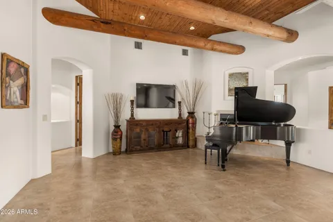 a kitchen with stainless steel appliances granite countertop a refrigerator a stove and a sink