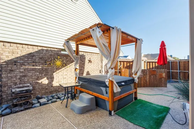 a backyard of a house with outdoor seating