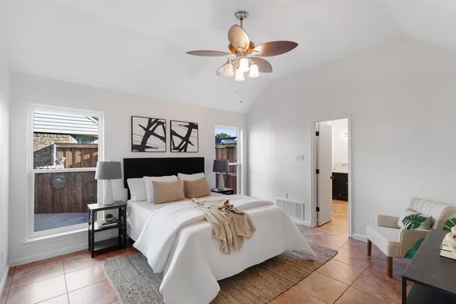 a bedroom with a bed and window