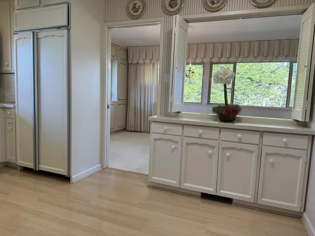 a view of walk in closet with clothes