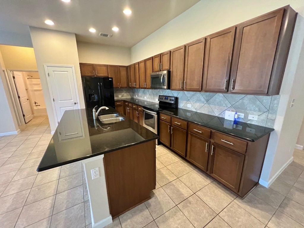 114 Clear Water Pass Bastrop, TX 78602 - Photo 13 of 37 Kitchen with huge eat-at island