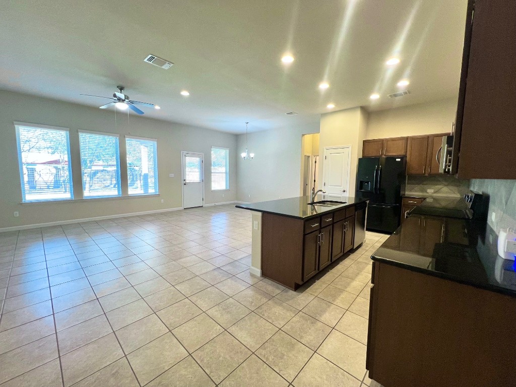114 Clear Water Pass Bastrop, TX 78602 - Photo 15 of 37 Kitchen open into the huge living space!