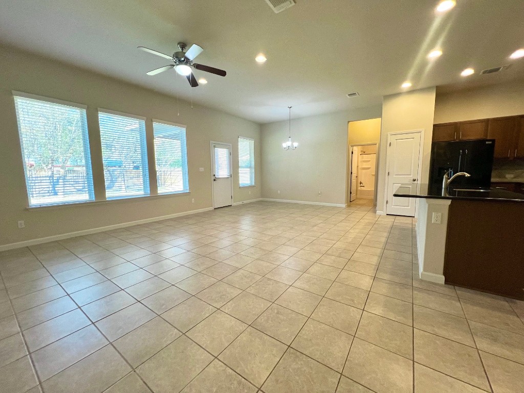 114 Clear Water Pass Bastrop, TX 78602 - Photo 16 of 37 Tiled living room and kitchen
