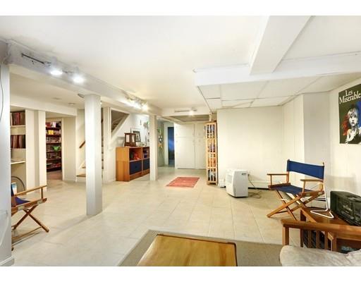 30 Helene Road Newton, MA 02468 - Photo 20 of 27 a living room with furniture and a flat screen tv