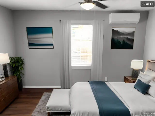 a bedroom with a bed and a potted plant