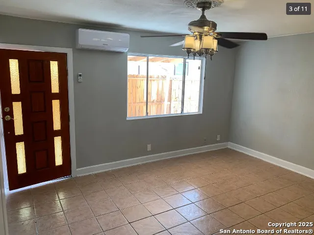 a view of empty room with windows