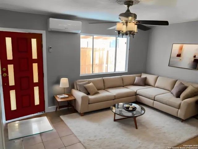 a living room with furniture and a window