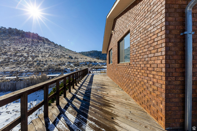 1208 East Tidwell Road Loa, UT 84747 - Photo 11 of 40 Deck featuring a mountain view