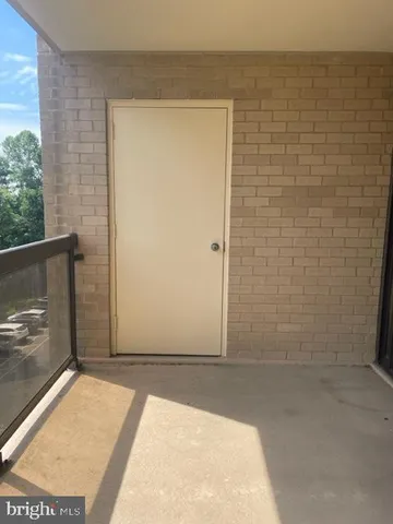 a kitchen with stainless steel appliances kitchen island granite countertop a table and chairs in it